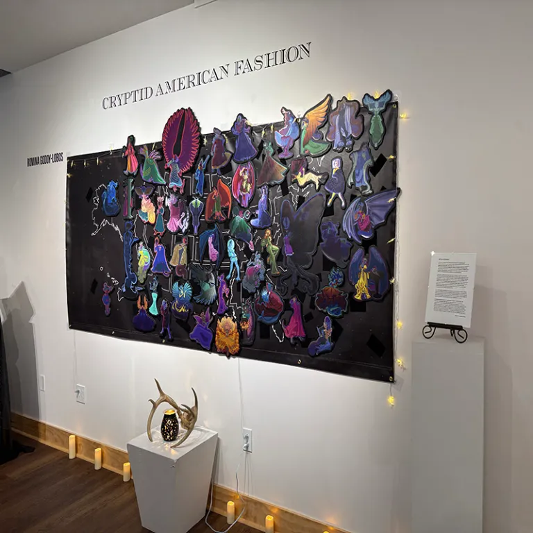 a photo of an exhibit on the wall with dark colors